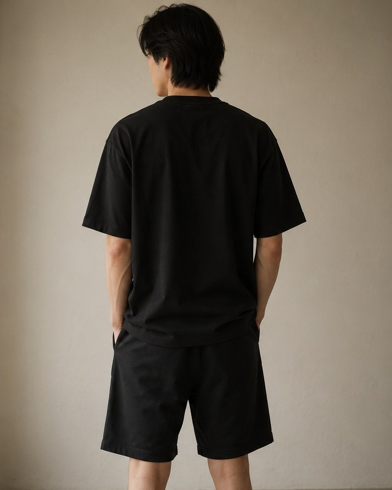 Élude - Shorts in black, worn back view showing the clean unbranded seat and side pockets